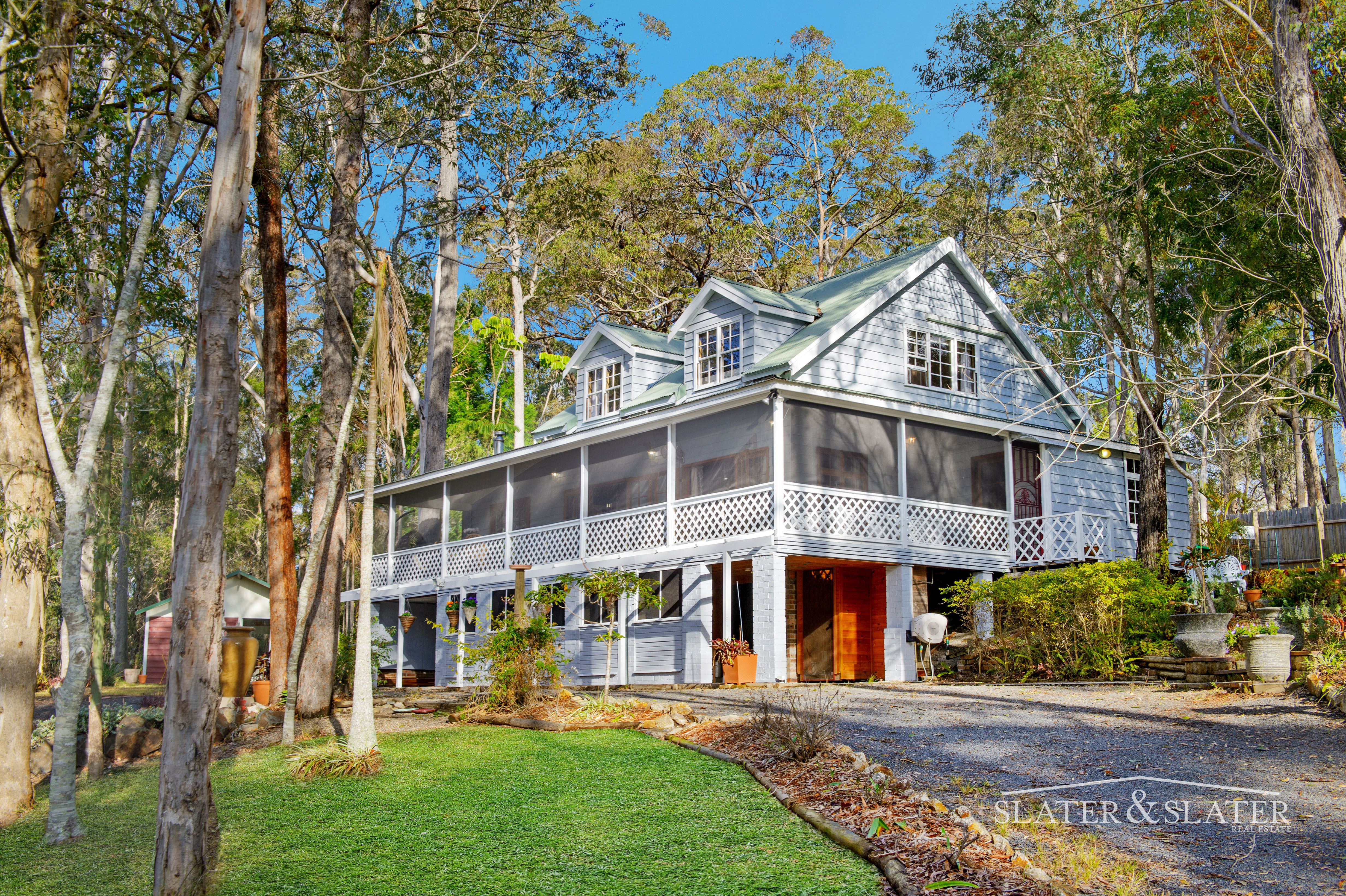 Slater & Slater Real Estate Distinctive home with separate studio on 3.8 acres in ideal location