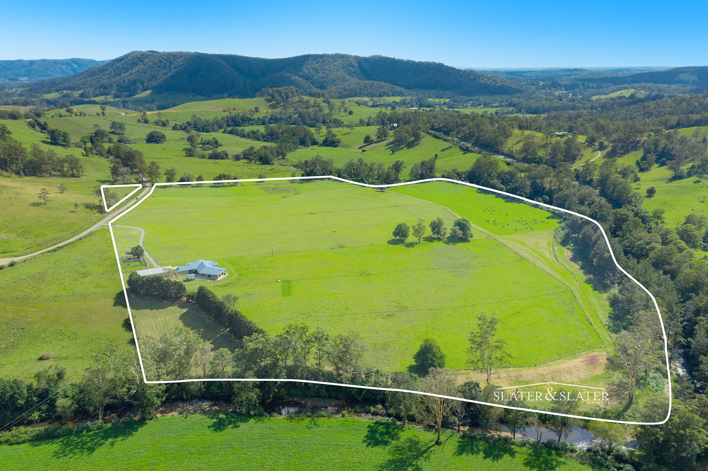 Slater & Slater Real Estate Prime riverfront acres with impressive home